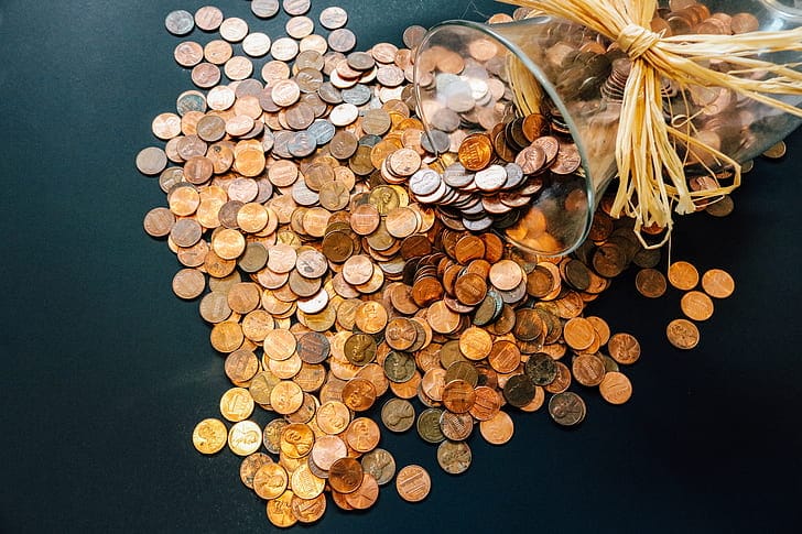Coins in jar for pay off debt faster article